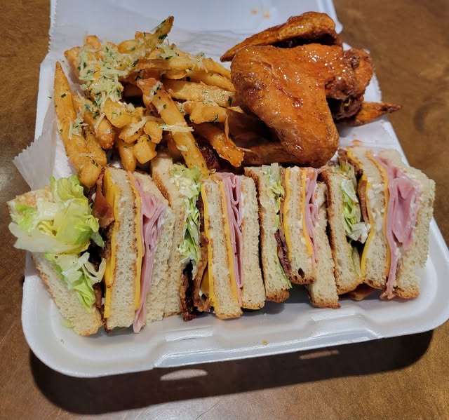 Keke's honey hot wings, club sandwiches, and garlic Parmesan fries