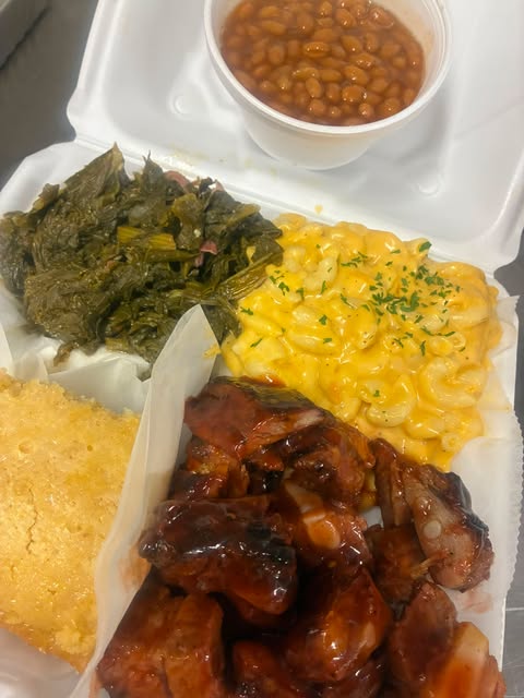 Keke's pork rib dinner with baked macaroni, greens, baked beans, and cornbread